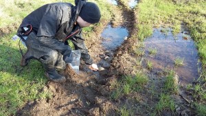 Scraping sediment at Willow Brook as part of the sediment fingerprinting © Trent Rivers Trust
