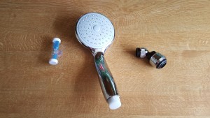 Shower timer, water saving shower head and tap fitting